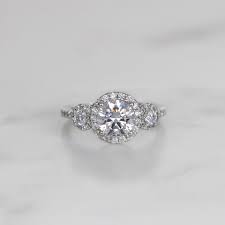 1/4 carat rose gold 3 stone semi mount engagement ring with pear shaped diamond. Three Stone Halo Round Cut Engagement Ring