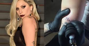 Lady gaga has a large tattoo of roses that sprawls from her lower back to the left side of her waist. Lady Gaga Uses Snapchat To Reveal The Dedication Behind Her Latest Tattoo Metro News