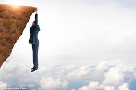 Gorgeous blue skies, with long branches of tree stretching upwards, the last of fall's leaves hanging on for dear life; Hang On Or Let Go Daily Mail Online