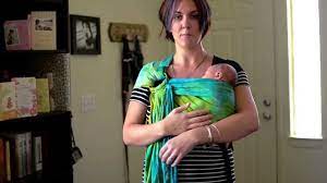 When you release the tension on the rings by lifting baby's weight not only does the fabric slide better making it easier to adjust, this method will preserve the life of your sling! How To Put A Newborn In A Ring Sling Youtube