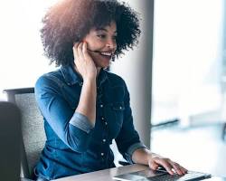 customer service representative smiling and talking to a customer