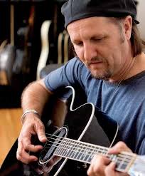 Wood & Steel Taylor Guitars