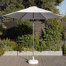 Garden parasols can be used to protect from the sun , offer privacy from neighbours and shelter a dining area and are available in plenty of sturdy and weatherproof materials. Eda White Parasol Base 0 74kg Diy At B Q