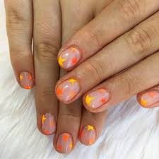 Black nails with orange pumpkins nail art. Neon Orange Nail Art Ideas Popsugar Beauty Uk