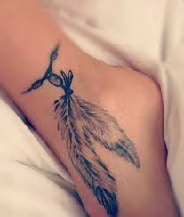 It is minimalistic in size but explosive when it comes to color. Tattoos On Feet Tattoo Ideas Mag Foot Tattoos Girls Feather Tattoos Tattoos
