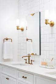New luxury vinyl tile floor. Love This White Bathroom The Tile Pattern Is Amazing And You Have To Love The Gold Fixtures Bathroom Trends Subway Tile Patterns Bathroom Design
