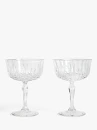 The dragonfly design is etched into the glass and is very nice. Champagne Flutes Saucers John Lewis Partners