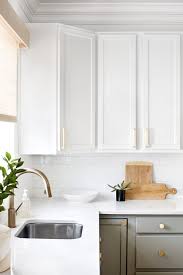 White Upper Gray Lower Kitchen Cabinets With Brass Hardware Elizabeth Lawson Elizabeth Lawson Interior Design Kitchen Kitchen Design Decor Kitchen Design