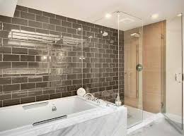 This traditional bathroom by four brothers llc, via houzz, is an excellent example of how you can accent subway tile with a small strip of colored mosaic. 20 Beautiful Bathrooms Using Subway Tiles Home Design Lover