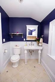 Every inch of the room is covered — wallpapered walls, painted cabinets, and a patterned ceiling. Decorating Bathroom With Blue And White