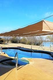Tan Shades Over Backyard Swimming Pool Pool Shade Swimming Pools Backyard Pergola Shade