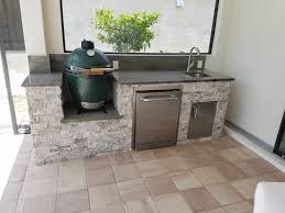 big green egg in custom outdoor kitchen