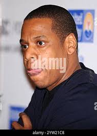 In this Dec. 13, 2011 photo, Jean Ashton, left, library director at the  New-York Historical Society, and Matthew Murphy, the library's head of  cataloging, display part of an ongoing collection of Occupy