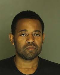 40-oz. beer drinking man cocks gun behind York City Police officer