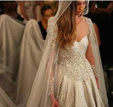 The Gown S A Little Odd But I Like The Cape Veil How Amazing Is This Cape Like A Game Of Thrones Theme Wedding Cape Beautiful Dresses Bridal Gowns