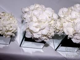 For easy design mechanics use clear waterproof tape, this grid will provide support for the flower stems and is essential when designing in cube vases. Mirror Cube Vase Hire Dress It Yourself