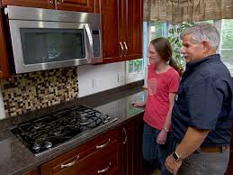 The backsplash space between a countertop and wall cabinets usually can be filled with two or three horizontal tile rows, depending on the size of your tiles. How To Install Backsplash Easily This Old House