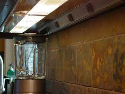 Under cabinet outlet strip and light. Hide Your Electrical Outlets To Streamline Your Kitchen Design