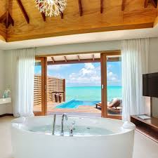 The Luxurious Indoor Outdoor Bathroom Has A Jacuzzi Bathtub And Rain Shower With Amazing View On Ocea Indoor Outdoor Bathroom Outdoor Bathrooms Bathtub Remodel