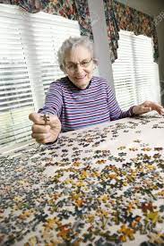 Find hundreds of free jigsaw puzzles to piece together on your computer or to share with friends. Smiling Elderly Woman Putting Together A Jigsaw Puzzle Vertical Shot Stock Photo Picture And Royalty Free Image Image 6271453