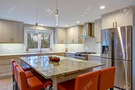 Backsplash tiles are as beautiful and varied as they are practical and protective. Gorgeous Kitchen Design Features Ivory Kitchen Cabinets Flanking Stock Photo Picture And Royalty Free Image Image 96677046