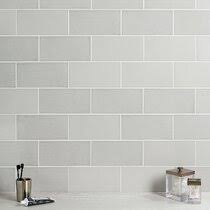 A grey and white kitchen featuring a white subway tile backsplash, ikea cabinets, hardwood floors, marble lookalike quartz countertop, and gold hardware. Gray Subway Backsplash Tile You Ll Love In 2021 Wayfair