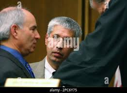 Elliot Weinstein, left, defense lawyer for Neil Entwistle speaks at the  bench with prosecutor Michael Fabbri, center, and Judge Peter Lauriat  during a hearing at Middlesex Superior Court in Cambridge, Mass., Friday,