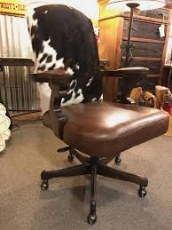 Even if your job necessitates those extra hours, the style and comfort of these rustic furnishings will make your tasks much easier. Bovina Western Leather And Cowhide Office Chair Rustic Desk Chair Hat Creek Interiors