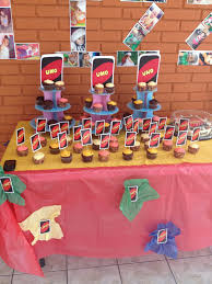 Uno Themed 1st Birthday Cupcake And Table Decorations 1st Birthday Cupcakes First Birthdays Birthday Cupcakes