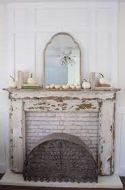 simple mantel with white pumpkins distressed fireplace faux fireplace mantels country house decor