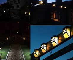 Warm Light Xlux S55 Solar Powered Lights For House Outdoor Landscape Garden Fence Lamp Soft White 2 Pack Solar Fence Lights Solar Lights For House Outdoor Solar Lights