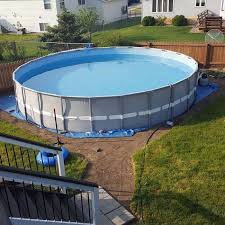 Making An Outdoor Oasis Around Your Intex Pool Outdoor Oasis Backyard Pool Pool Landscaping