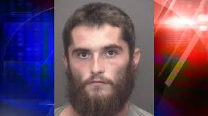 Evansville man arrested after allegedly damaging home with an axe with  children inside