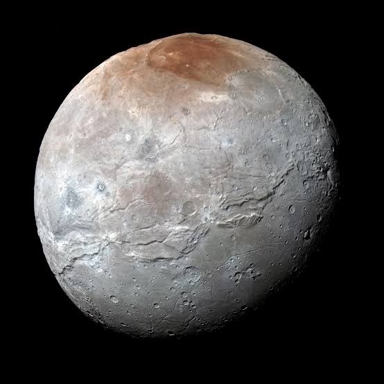Pluto May Have Captured Its Biggest Moon Charon After an Ancient Dance and Kiss - The New York Times