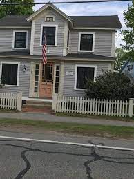 Light grey with white trim can achieve an entirely new look when just a slight hint of color modifies the siding's overall tone. Gray House With Cream Trim