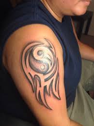 In film, fashion, music, theater and tv industry! Yin Yang Tribal Shoulder Tattoos Shoulder Tattoos Tattoos