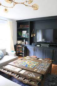 Learn How To Create The Ultimate Game Room Create A Game Room In Plain Sight With Diy Livi Living Room Diy Black Furniture Living Room Living Room Built Ins