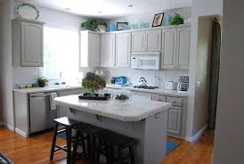 Black Appliances With Light Grey Cabinets I Like This Island And Color Scheme Grey Kitchen Colors Grey Kitchen Grey Kitchen Cabinets