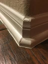 Base Board With Quarter Round On Transition From Laminate To Tile Floor Around Corner With Rolled Edges House Flooring Flooring Home Staging