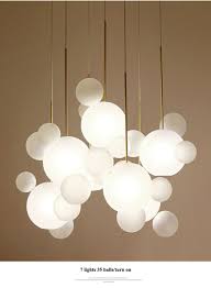 A minimalist design featuring a metal frame of black round glass balls in your choice of mirror smoke for a contemporary style or champagne for more transitional decors. Modern Mickey Led Chandeliers Lighting Dining Room Frosted Glass Ball Led Chandelier Coppe Modern Hanging Lights Chandelier In Living Room Dining Room Lighting