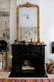 Antique Black And Gold Mirror At Home In Amsterdam Sfgirlbybay Mirror Over Fireplace Decor Vintage Fireplace