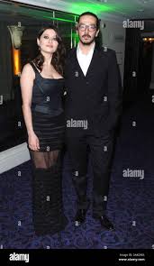 Photo Must Be Credited ©Kate GreenAlpha Press 077037 24032013 Nurgul  Yesilcay & Tolga Karacelik Jameson Empire Film Awards 2013 Grosvenor Hotel  London Stock Photo - Alamy