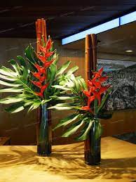 Heliconia And Monsteria Reception Desk Tropical Flower Arrangements Modern Flower Arrangements Flower Arrangements Simple