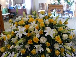 Personal tributes designed with compassion and skill to honor your memories. Casket Spray Yellow And White Roses White Lilies Funeral Flower Arrangements Casket Flowers Funeral Flowers