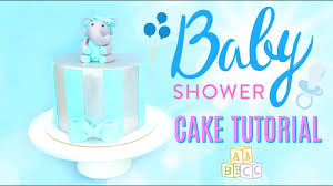 The cake is covered in a pale, blue fondant and topped with a large pair of white booties tied with a blue. Simple Easy Fondant Elephant Baby Shower Cake Youtube