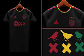 The shirt has a black base colour with green, yellow and red adidas stripes on the shoulders whilst the cuffs are also made up of the same three colours. Reggae Y Futbol Asi Rinde Tributo El Ajax A Bob Marley 24 Horas Puebla