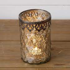 Mercury glass has become a favorite for wedding decorations and holiday accents because of its shimmering beauty and versatility. Silver Mercury Glass Candle Holder Large Home Decor Candles Candle Holders Glass Iron Size 5 5 X 3 5 Shop Audrey S For Wholesale Home Decor Seasonal Gif