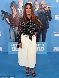 By paul chavez for dailymail.com. Salma Hayek Looks Effortlessly Chic In A White Maxi Skirt At The Hitman S Wife S Bodyguard Premier Daily Mail Online