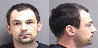 Man charged with crashing vehicle into apartment building