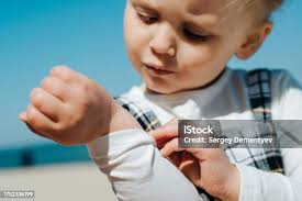 Boy Covered In Lady Bugs Stock Photo